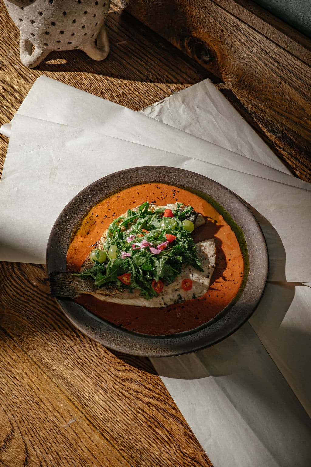 Grilled Branzino — Chupe sauce & smoked grapes